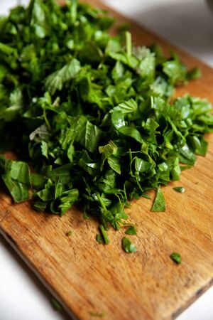 sorrel on a cutting Board on a white tableの写真素材