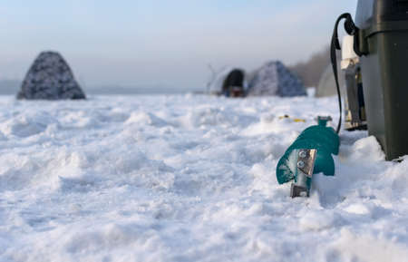 Fishing for a frozen pondの写真素材