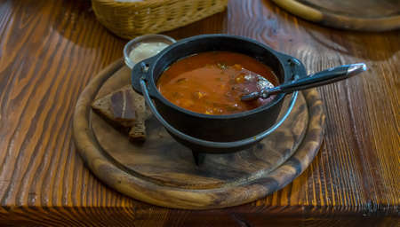 Russian soup, borsch, in a cast iron potの写真素材