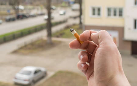 smoking man with smoking cigaretteの写真素材