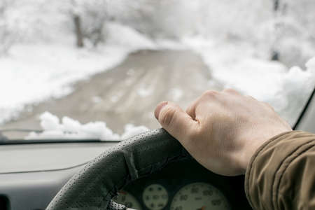 Man hand on the steering wheelの写真素材