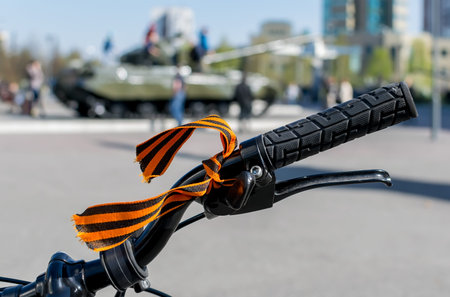 George ribbon tied to the handle of a Bicycle