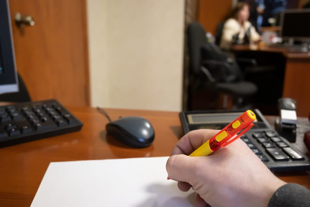 type of writing pen in the hand of an office employee