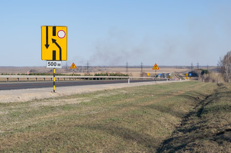 many signs about road repairs on a country highway
