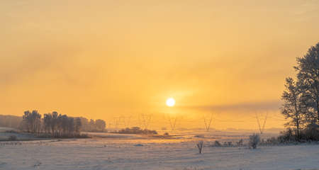 winter, frosty landscape of nature with dim evening sunlightの写真素材