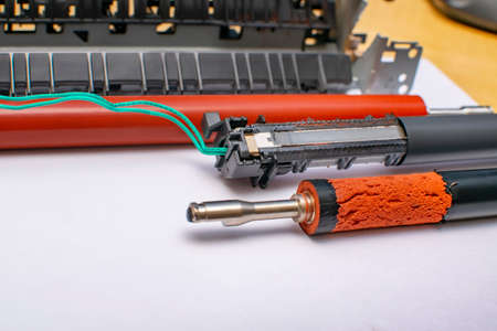 view, sample of the damaged surface of the rubber heating shaft and torn thermal film on the thermoelectric element of the laser printerの写真素材