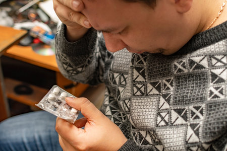 the master of the service center holds medicines in his handの写真素材