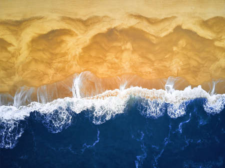 Aerial View looking down on a Beach. Deep Blue waves and beach.の写真素材