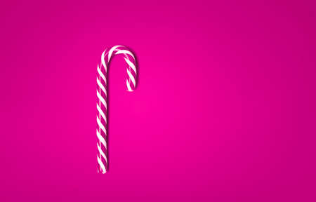 Caramel spiral sticks. red and caramel spiral sticks on the red background.の写真素材