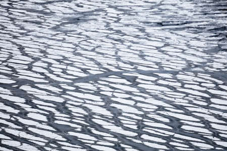 ice on the pond. water freezing.の写真素材