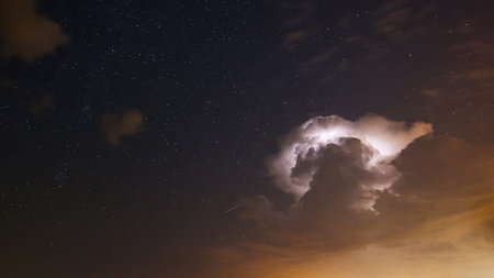 Starry night with Thunderstorm in heavenの写真素材