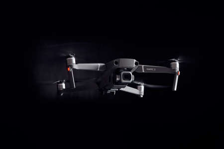 DJI Mavic 2 Pro - Flying in the dark, on black background. Closeup on dark. One of the most portable drones in the market. View on drones gimbal and camera. 12.10.2018 Rostov-on-Don. Russia.のeditorial素材
