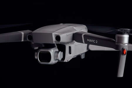 DJI Mavic 2 Pro - Flying in the dark, on black background. Closeup on dark. One of the most portable drones in the market. View on drones gimbal and camera. 12.10.2018 Rostov-on-Don. Russia.のeditorial素材
