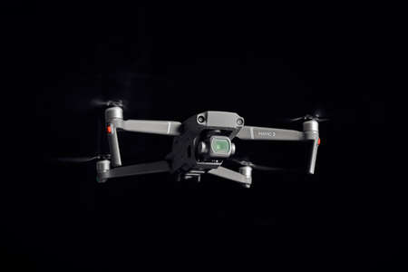 DJI Mavic 2 Pro - Flying in the dark, on black background. Closeup on dark. One of the most portable drones in the market. View on drones gimbal and camera. 12.10.2018 Rostov-on-Don. Russia.のeditorial素材