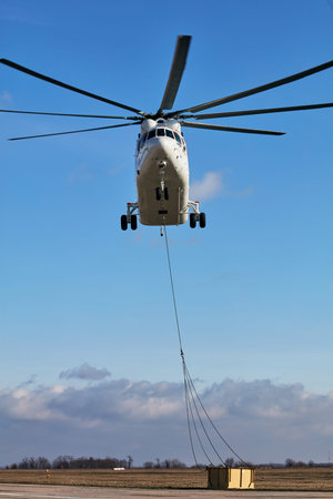 Transport helicopter Mi-26 TC Transfers load on the external suspension. Heavy helicopter (on the...