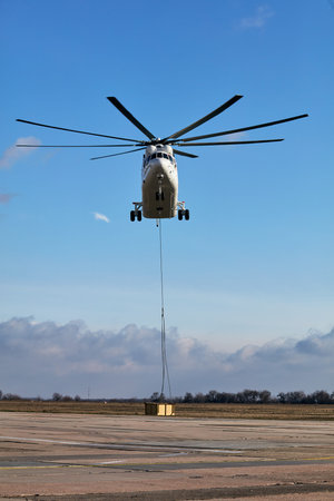 Transport helicopter Mi-26 TC Transfers load on the external suspension. Heavy helicopter (on the...
