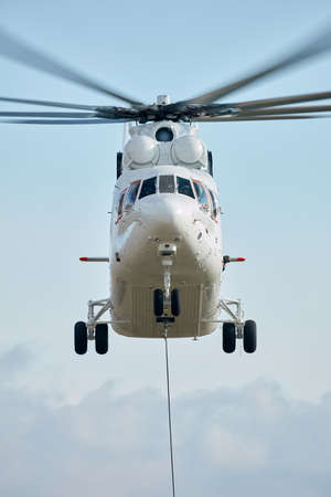 Transport helicopter Mi-26 TC Transfers load on the external suspension. Heavy helicopter (on the codification of NATO: Halo) is a heavy multipurpose transport helicopter. 13.12.2018, Rostov Region, Russiaのeditorial素材