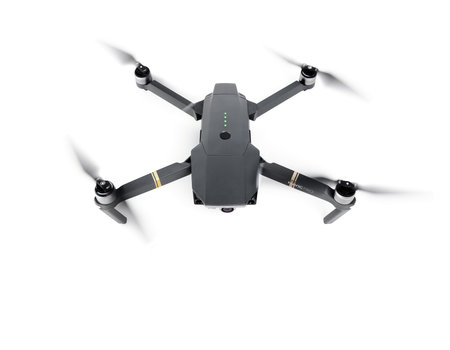 DJI Mavic Pro drone in flight, on white background. One of the most portable drones in the market....