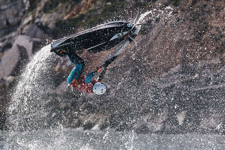 Professional jet ski riders compete at the IFWA World Tour Jet Ski Championship. Contestants perform tricks for judges in the waves. Freeride World Championship IFWA. 27.04.2018, Nazare, Portugalのeditorial素材