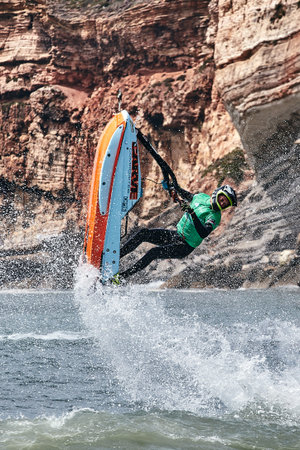 Professional jet ski riders compete at the IFWA World Tour Jet Ski Championship. Contestants perform tricks for judges in the waves. Freeride World Championship IFWA. 27.04.2018, Nazare, Portugalのeditorial素材
