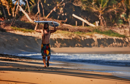 Surfer with Board. Water sport activity. Atlantic Ocean, Dominican Republic.