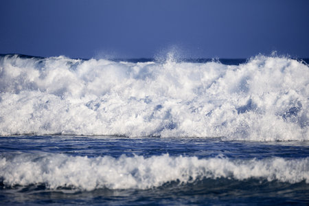 Blue wave, Clear water and spray on the Atlantic oceanの写真素材