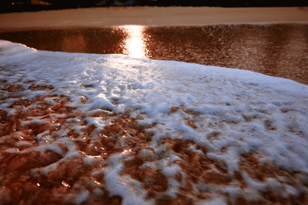 Wave On Sandy Beach. Background. Splash of waves on the sandy beach. foam, surf, waves.の写真素材