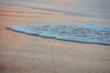 Wave On Sandy Beach. Background. Splash of waves on the sandy beach. foam, surf, waves.