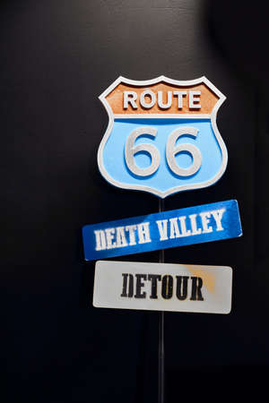 Historic Route 66 Road Sign. Road sign on a black background.のeditorial素材