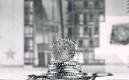 1 Euro cent against 500 Euro banknote, coins and banknotes of the single European currency. Money backgroundの写真素材