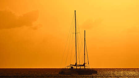 Yachts in the Bay. Silhouettes of yachts at sunset.の写真素材