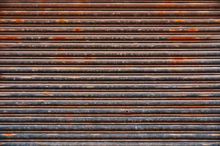 Old Roll-up Garage Gate. Old rusty garage doors.の写真素材