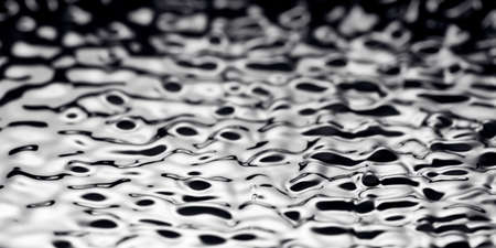 Movement of water - Abstract Black Background Liquid Texture. liquid abstraction.の写真素材