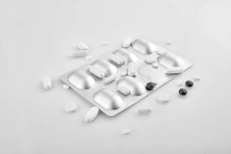 Medicines - saving lives. Assorted pharmaceutical medicine pills, tablets and capsules on white background.の写真素材