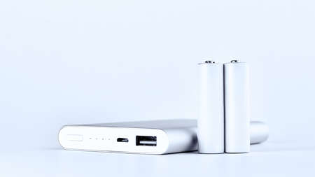 Portable power bank for charging mobile devices and AA batteries. mobile charging, modern power supplies.の写真素材