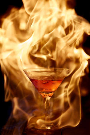 cocktail on fire. fiery cocktail. fire on the bar.の写真素材
