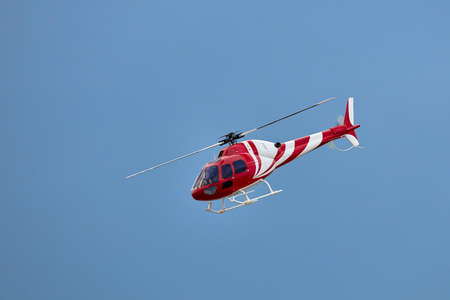 Radio controlled model helicopter in flight.の写真素材