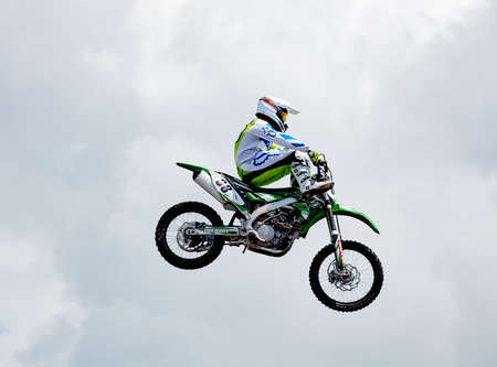 Professional rider at the FMX (Freestyle Motocross) make an acrobatic jump at the motorshow. Rostov Drive Show 2017.28.05.2017, Rostov-on-Don, Russia.のeditorial素材