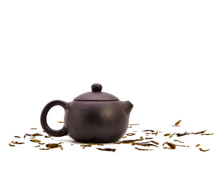 Retro clay Chinese teapot isolated on a white background. small earthenware.の写真素材