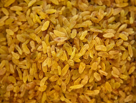 Raisins Background. Yellow Sultanas. Golden Dried Seedless Grapes Top View.の写真素材