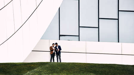 Businessmen on the background Heydar Aliyev Center. Baku, Azerbaijan, 27.04.2017のeditorial素材