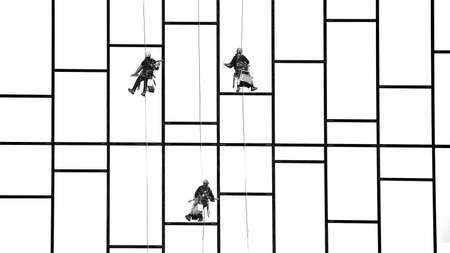 Window Cleaner at Working. Window cleaner, in the suspension system. Industrial mountaineering.の写真素材