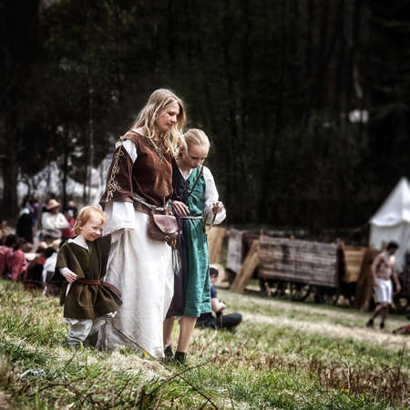 Mother and children medieval Europe. Medieval battle - historical reconstruction. Czech Republic, Libusin, 25 04 2015のeditorial素材