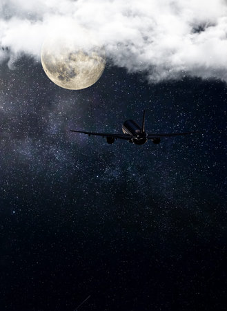 Airliner flying in the night, starry sky and moon.