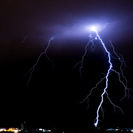 Lightning storm over city, thunderbolt