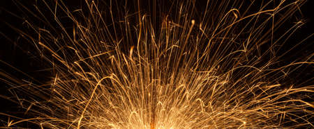 Burning sparkler on black backgroundの写真素材
