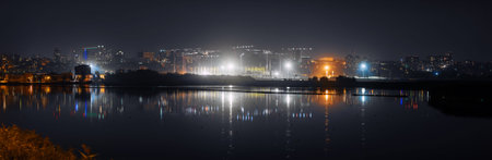 Night city and construction site, Reflected in the water, Rostov-on-Don, Russiaの写真素材