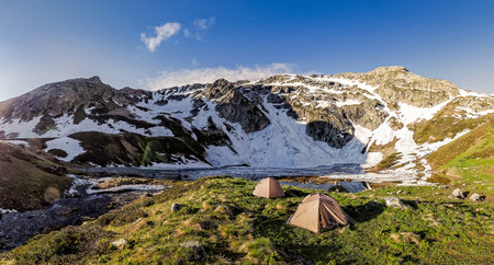 Turist tent at mountain lake.Caucasus mountains, Sophia lake, panoramaの写真素材