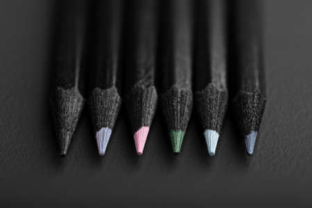 black, colored pencils, on black backgroundの写真素材