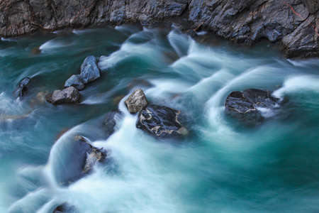 Mountain river stones in the streamの写真素材